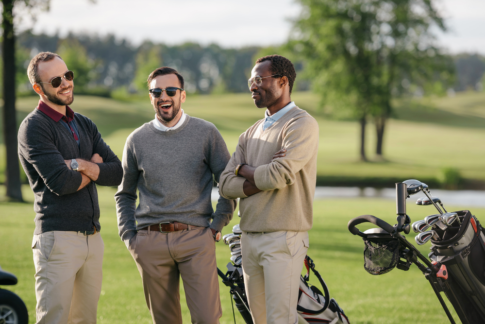 three men at a golf course