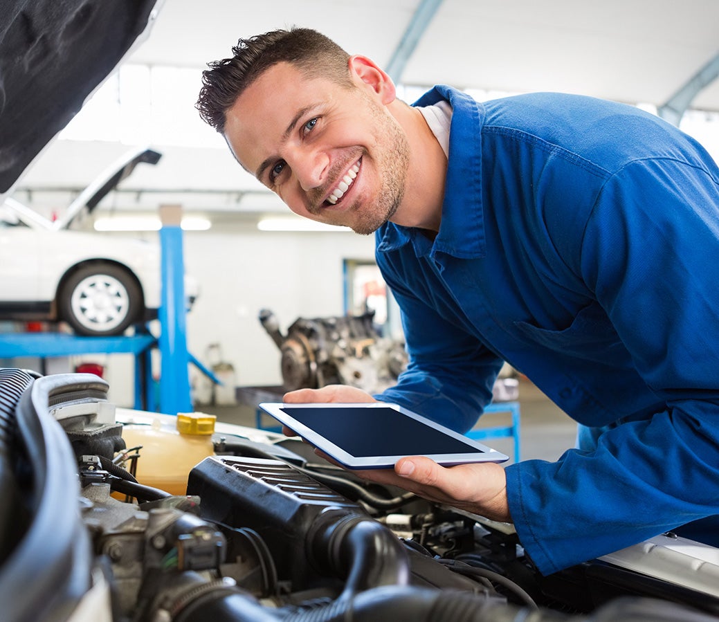 Cadillac technician performing spring maintenance service